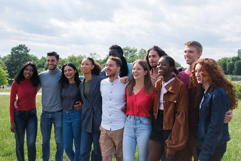 group of young people from different cultures smiling for a photo